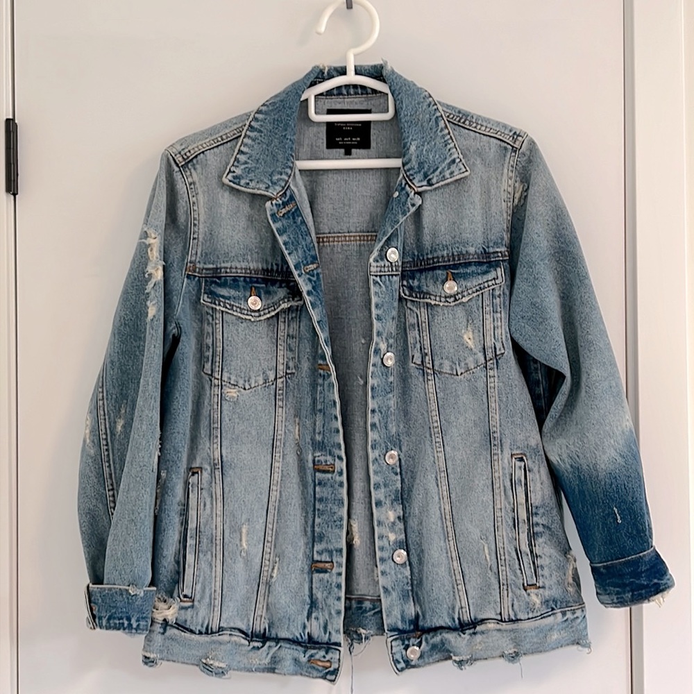 Ripped denim jacket.